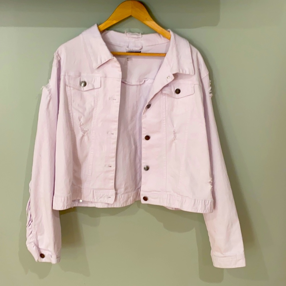 White denim jacket in a size x large.